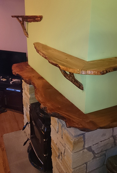 natural edge wood mantlepiece and shelves